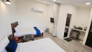 Letto o letti in una camera di Stay if you wish Homestay