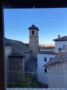 a view from a window of a city with a tower at Apartamento Elvira in Granada