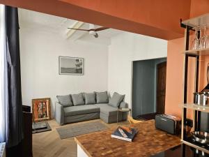 a living room with a couch and a table at Blue Note Home, Port Vieux, Parking, Crew, Couple in La Ciotat