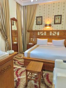 A bed or beds in a room at Teba Hotel Ras Elbar