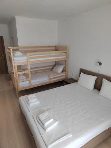 Postel nebo postele na pokoji v ubytování ARIA