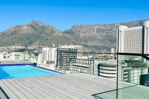 a view from the roof of a building with a swimming pool at The Tokyo 1211 in Cape Town