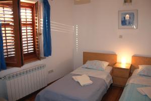 Ένα ή περισσότερα κρεβάτια σε δωμάτιο στο Mata Apartments