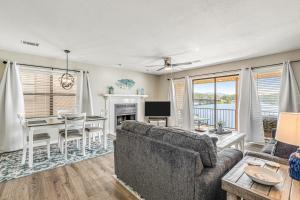 a living room with a couch and a table at Lake Escape in Hot Springs