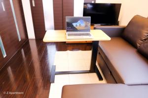 TV o dispositivi per l'intrattenimento presso Z Apart ment 大阪通天閣玩具街旅居