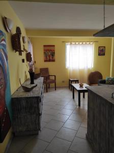 a living room with a couch and a table at Casa Laranja Santa Maria in Santa Maria