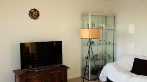 a bedroom with a bed and a glass shelf at OASIS in Buarcos