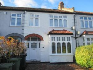 a white house with a white door at Cheerful well presented 3 Bedroom period house in Forest Hill