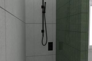 a shower with a shower head in a bathroom at David Design Apartment centro storico in Caorle