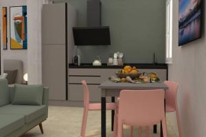 a living room with a table with a bowl of fruit at David Design Apartment centro storico in Caorle