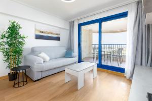 Ένα ή περισσότερα κρεβάτια σε δωμάτιο στο ApartUP Patacona Surfing Beach