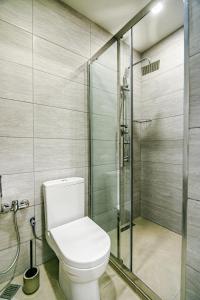 a bathroom with a toilet and a shower at Sabah residance one bedroom in Baku +15 photos