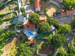 an overhead view of a house with a swimming pool at Holiday house Villa Sena , Lovreć, Makarska in Opanci