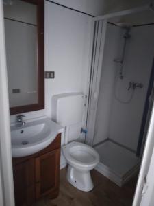 a bathroom with a toilet and a sink and a shower at Camping village Internazionale in Metaponto