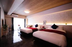 Ліжко або ліжка в номері Hotel Japanesque Fukuoka