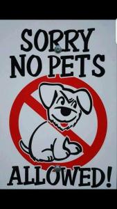 a sign that says sorry no pets allowed at great holidays hemsby in Hemsby