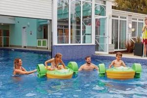 a group of people playing in a swimming pool at Modern 6 Berth Static Caravan, Hunstanton in Hunstanton