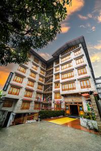 a building with a basketball court in front of it at Yangthang Heritage in Gangtok