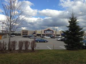 a store with a christmas tree in a parking lot at Four Points by Sheraton Barrie in Barrie