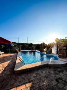 a large swimming pool in a brick yard at Ponte Romana in Silves