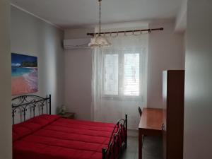Llit o llits en una habitació de Chiara Apartment