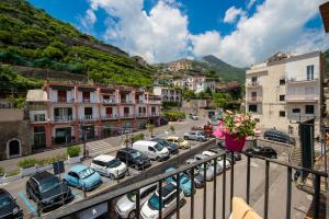 a city with cars parked in a parking lot at La Casetta di Camilla - Amalfi coast in Minori