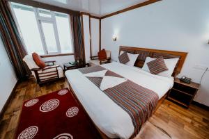 Giường trong phòng chung tại Sikkim Tourist Centre +104 ảnh