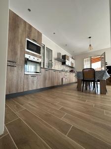 a living room with a kitchen and a dining table at Villa Valentina in Cefalù