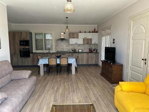 a living room with a couch and a table at Villa Valentina in Cefalù