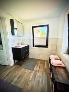 Ванна кімната в Ferienwohnung-Familienidylle-im-Vogtland-80qm