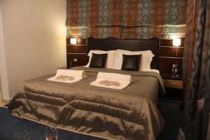 Ένα ή περισσότερα κρεβάτια σε δωμάτιο στο Lasia Hotel