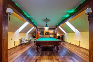 a pool table in the middle of a room at Amber dream Karkle in Karklė
