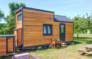 a wooden tiny house in a yard with a table at Lovely Home In Mayrhof With Wifi 