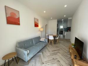 a living room with a couch and a table at Charming Benavente in Benavente