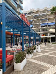 a row of tables and chairs in a building at Apartament amb vistes al mar! in Salou