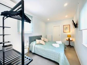 a bedroom with a bed and a bunk bed at Dimora San Gregorio in Palermo