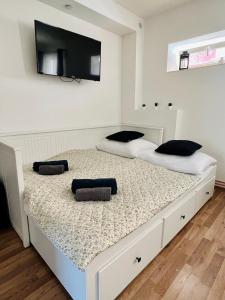 מיטה או מיטות בחדר ב-Penzion Nový Svět