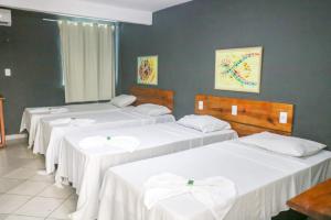 Uma cama ou camas num quarto em Porto Center Hotel