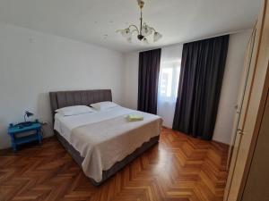 A bed or beds in a room at Mirjana apartment