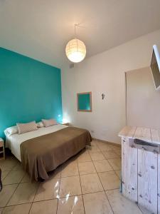 Posteľ alebo postele v izbe v ubytovaní Arcobaleno Tropea centro