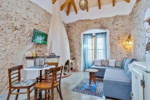 a living room with a couch and a table at The Farm Lodge in Marbella