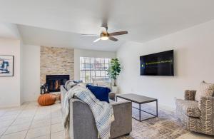 a living room with a couch and a ceiling fan at 92nd 1104 Scttsdale townhouse in Scottsdale