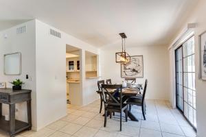 a dining room with a table and chairs at 92nd 1104 Scttsdale townhouse in Scottsdale