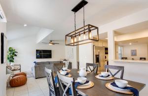 a dining room and living room with a table and chairs at 92nd 1104 Scttsdale townhouse in Scottsdale