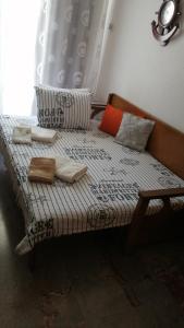 a bed in a room with at Aunt Vaso Sweet Home in Ptolemaida