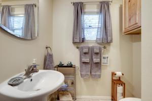 a bathroom with a sink and a window at Lakefront College Station Home Near Texas A and M! in College Station +24 photos