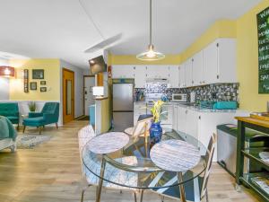 a kitchen and dining room with a table and chairs at Remington Flats in Fort Collins