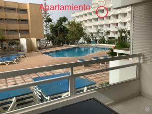 a view of the pool from the balcony of a hotel at Casa climatizada in Playa Fañabe