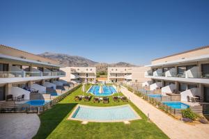 an aerial view of an apartment complex with a swimming pool at Vantaris Blue adults only in Kavros