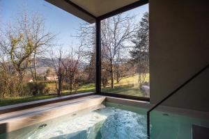 a view from a window of a hot tub at Maison Gokan in Sévrier